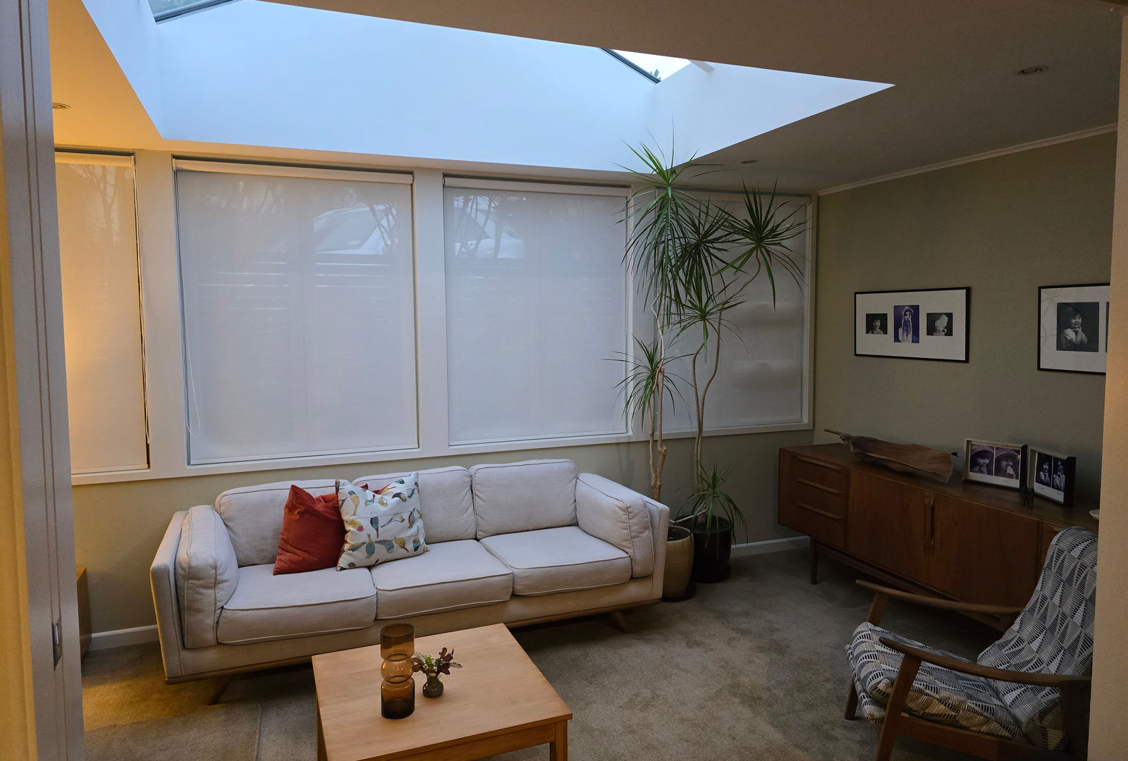Cellular honeycomb blinds insulating a bedroom window in a Wellington villa, soft neutral fabric with a warm daylight glow