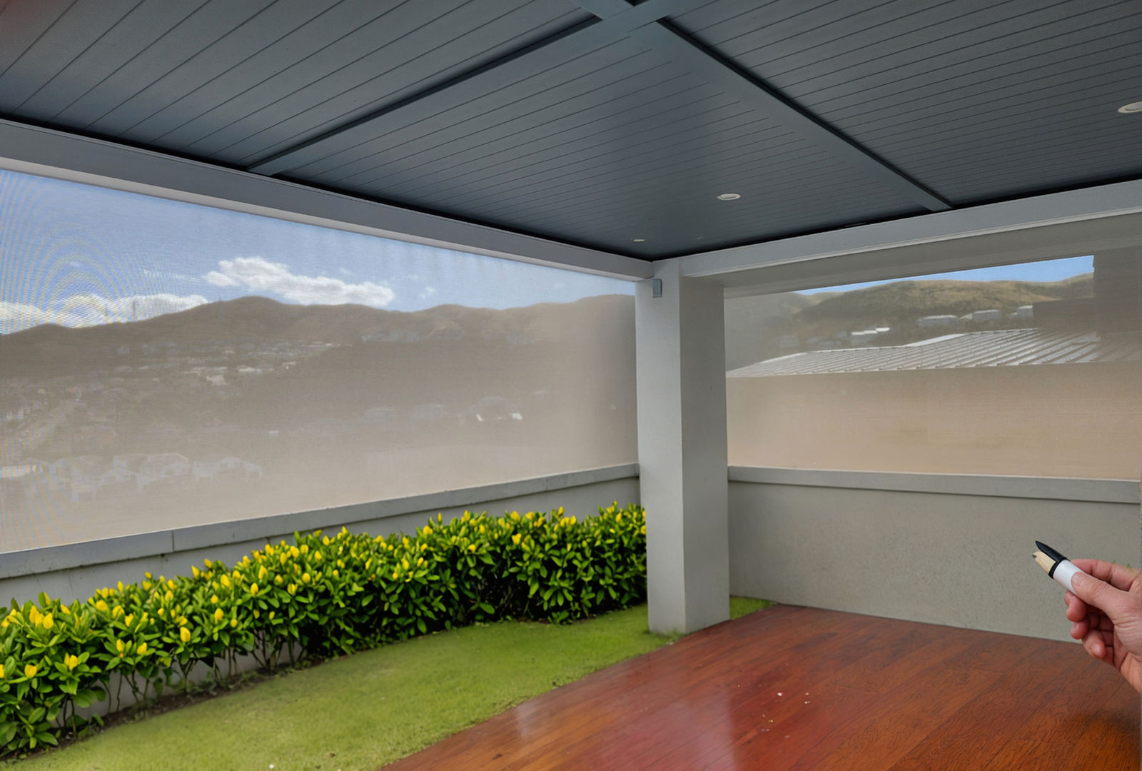 Outdoor Zipscreen blind extended down over an alfresco patio in Wellington, blocking wind while keeping the view